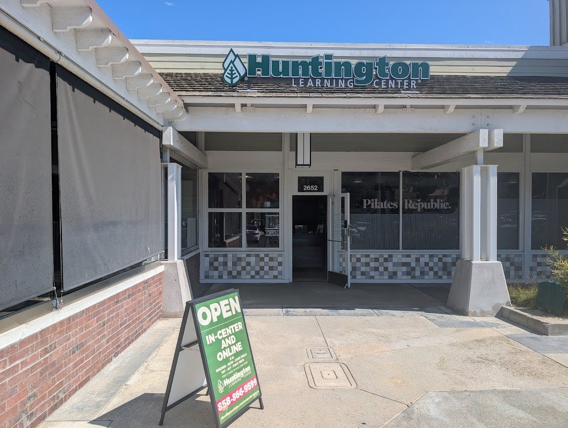 Storefront for Huntington Learning Center and Pilates Republic with an "OPEN" sign outside
