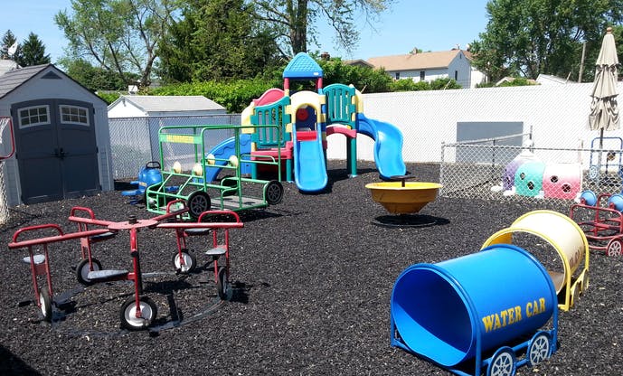Playground with slides, climbing structure, and various play equipment
