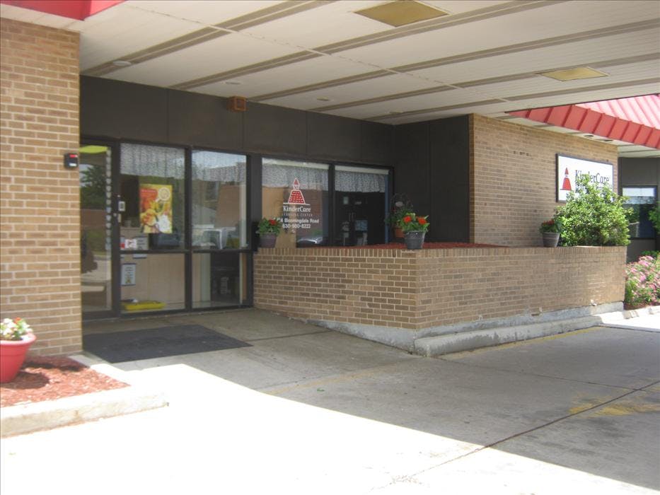 Entrance to a brick building with a sign for KinderCare Learning Center
