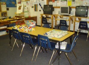 Classroom with a table and chairs, building blocks on the table