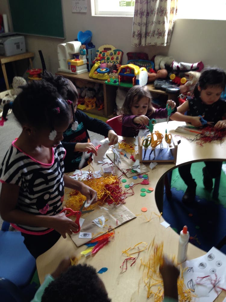 Children doing crafts at a table