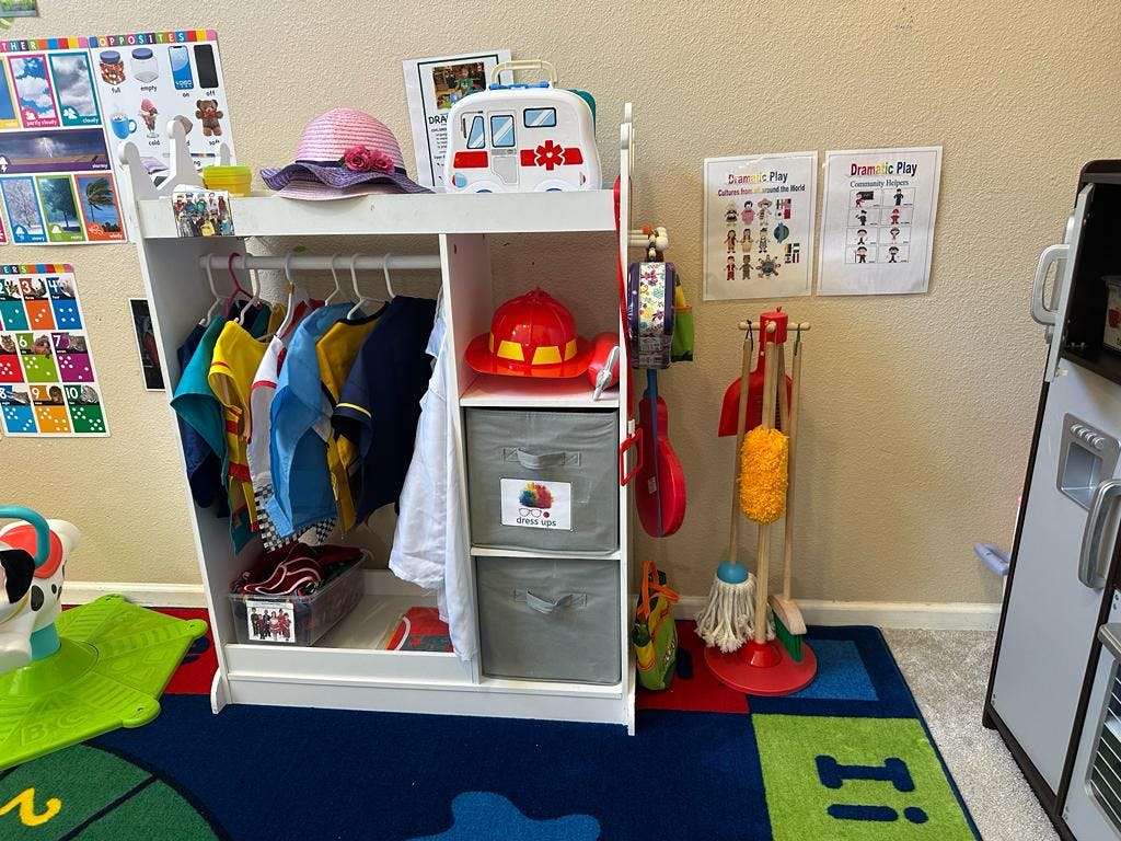 Children's dress-up clothes and toys in a classroom