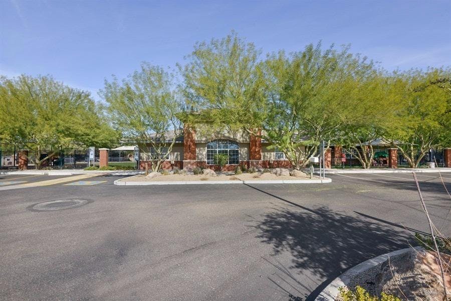 Building with trees and a circular driveway