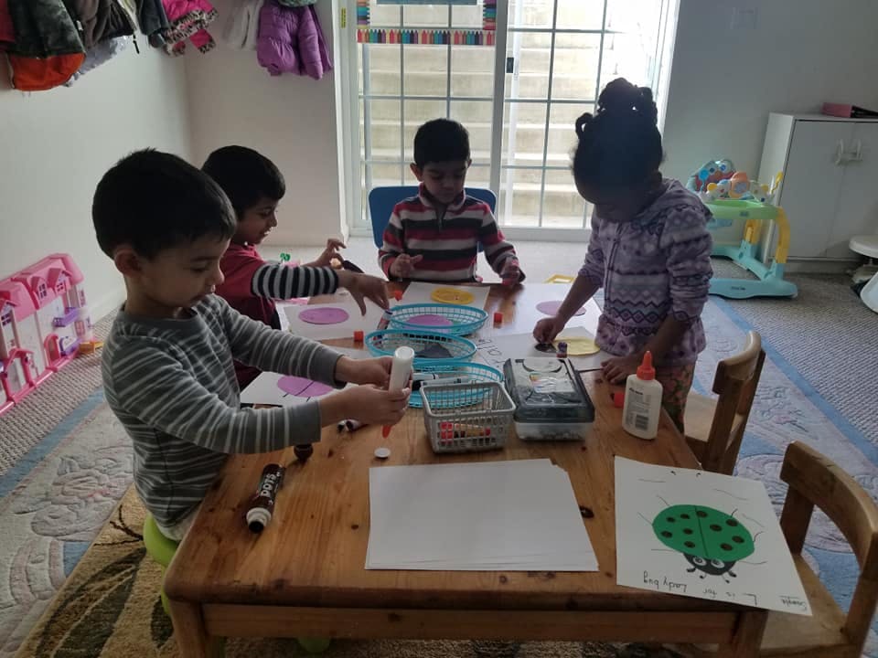 Children doing crafts at a table
