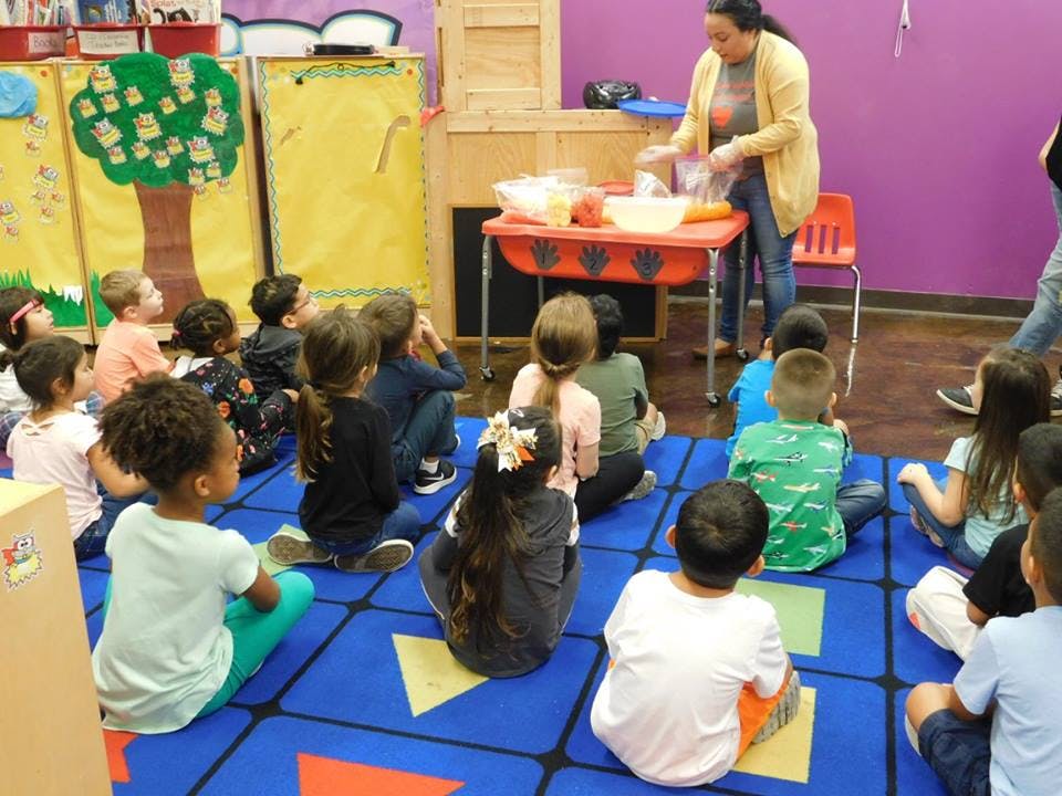 Person teaching children in a classroom