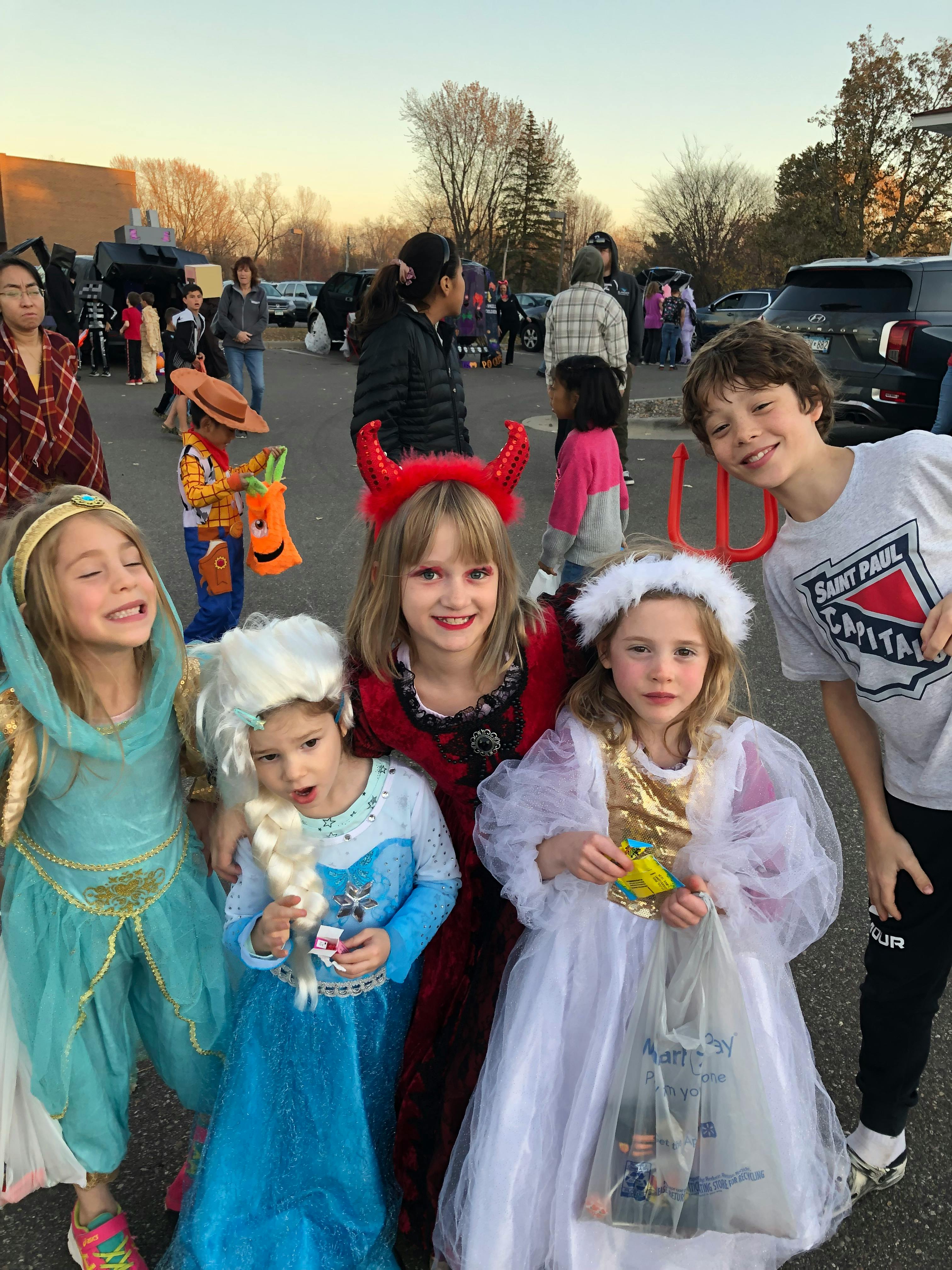 Children in costumes standing together outdoors
