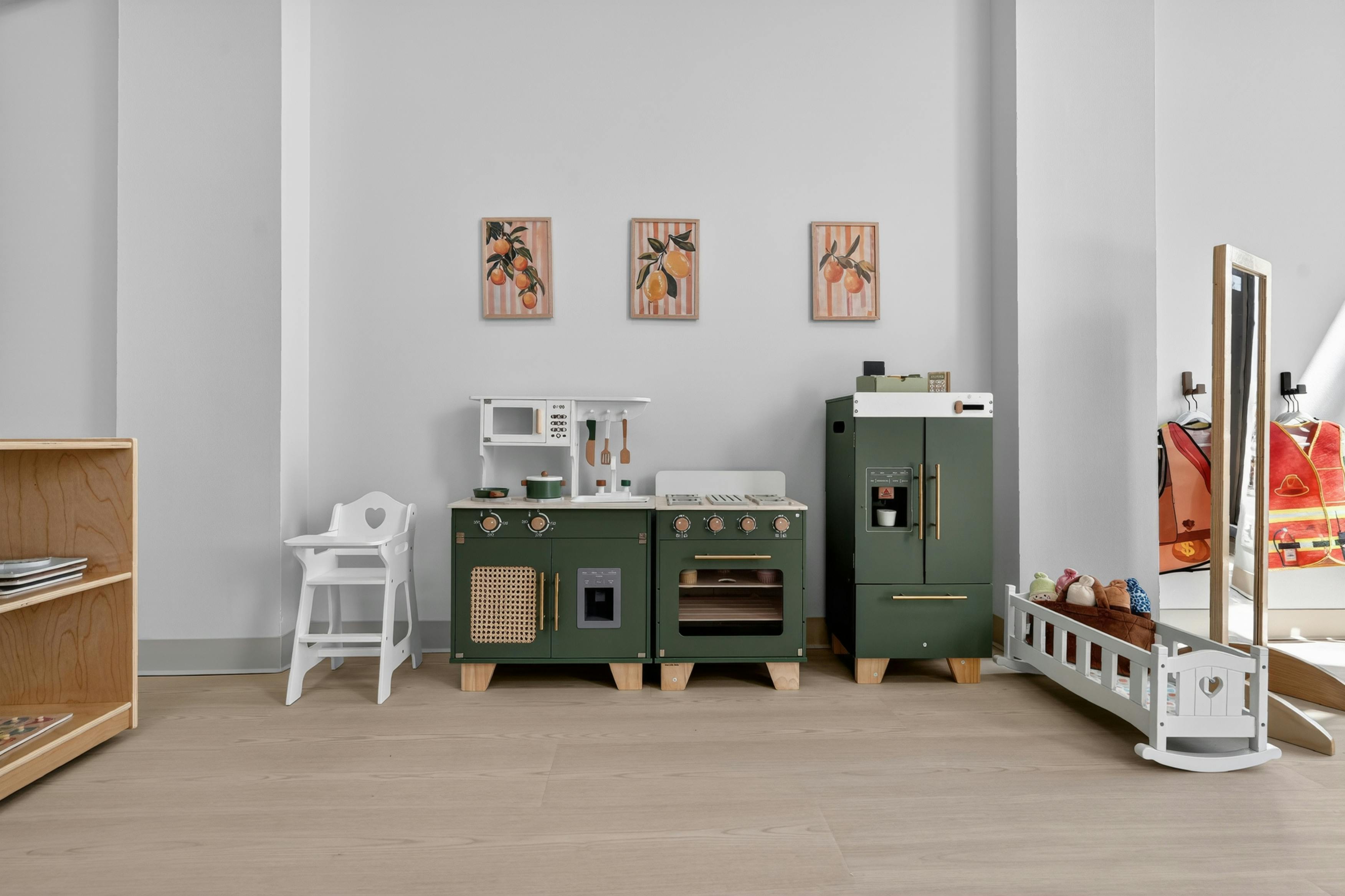 Toy kitchen set with play furniture in a playroom