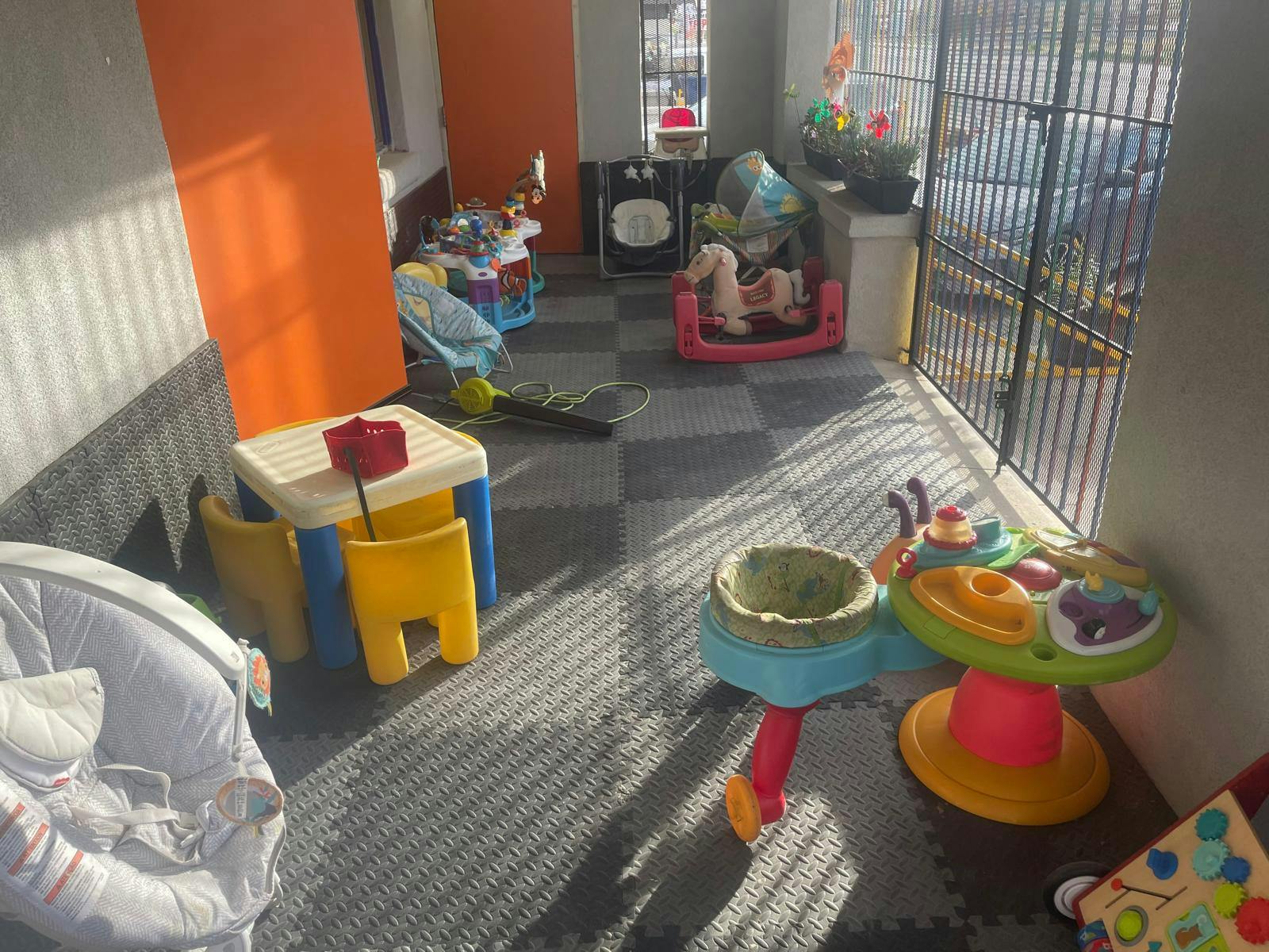 Playroom with various children's toys and furniture