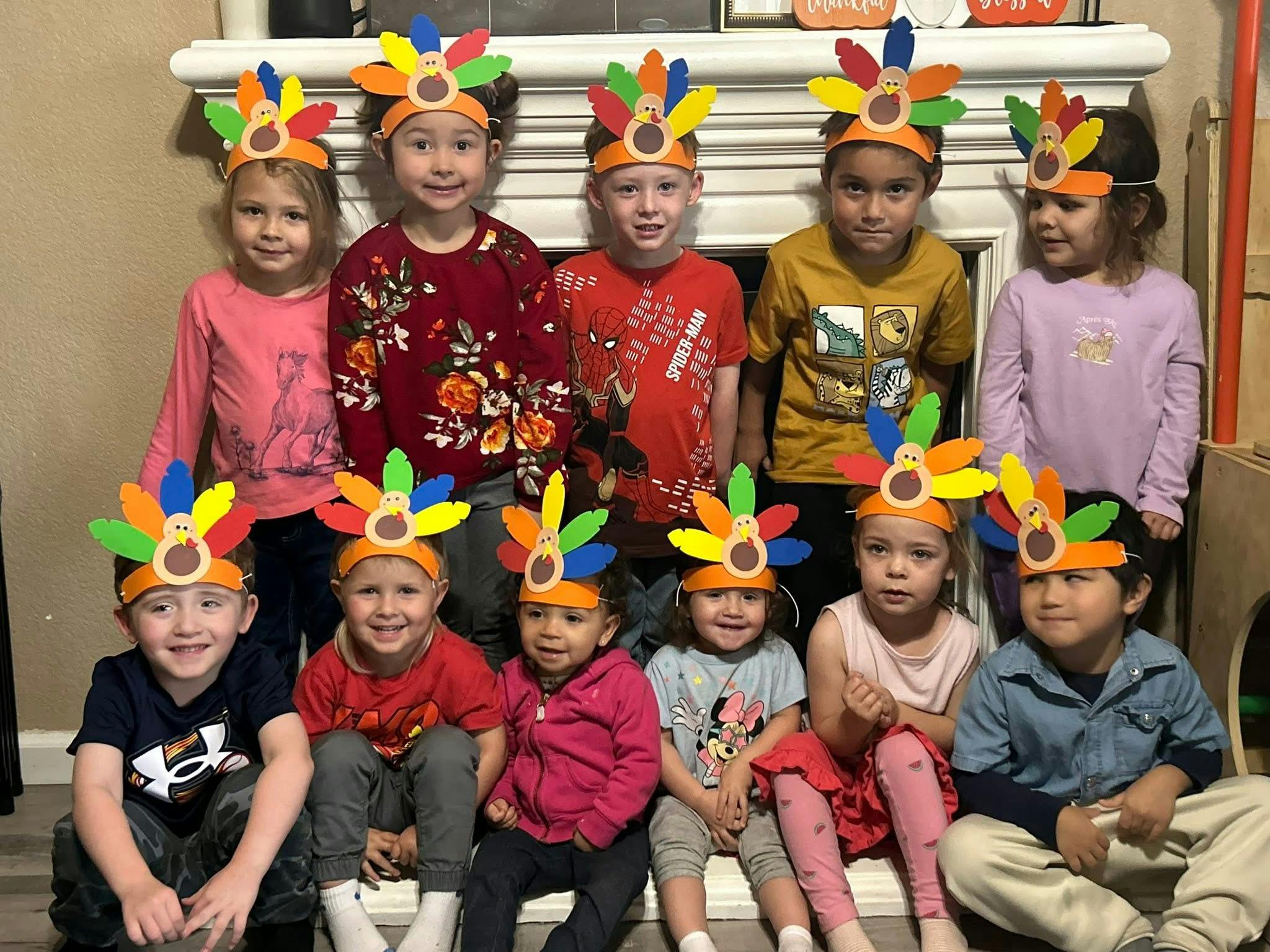 Group of children wearing turkey headbands