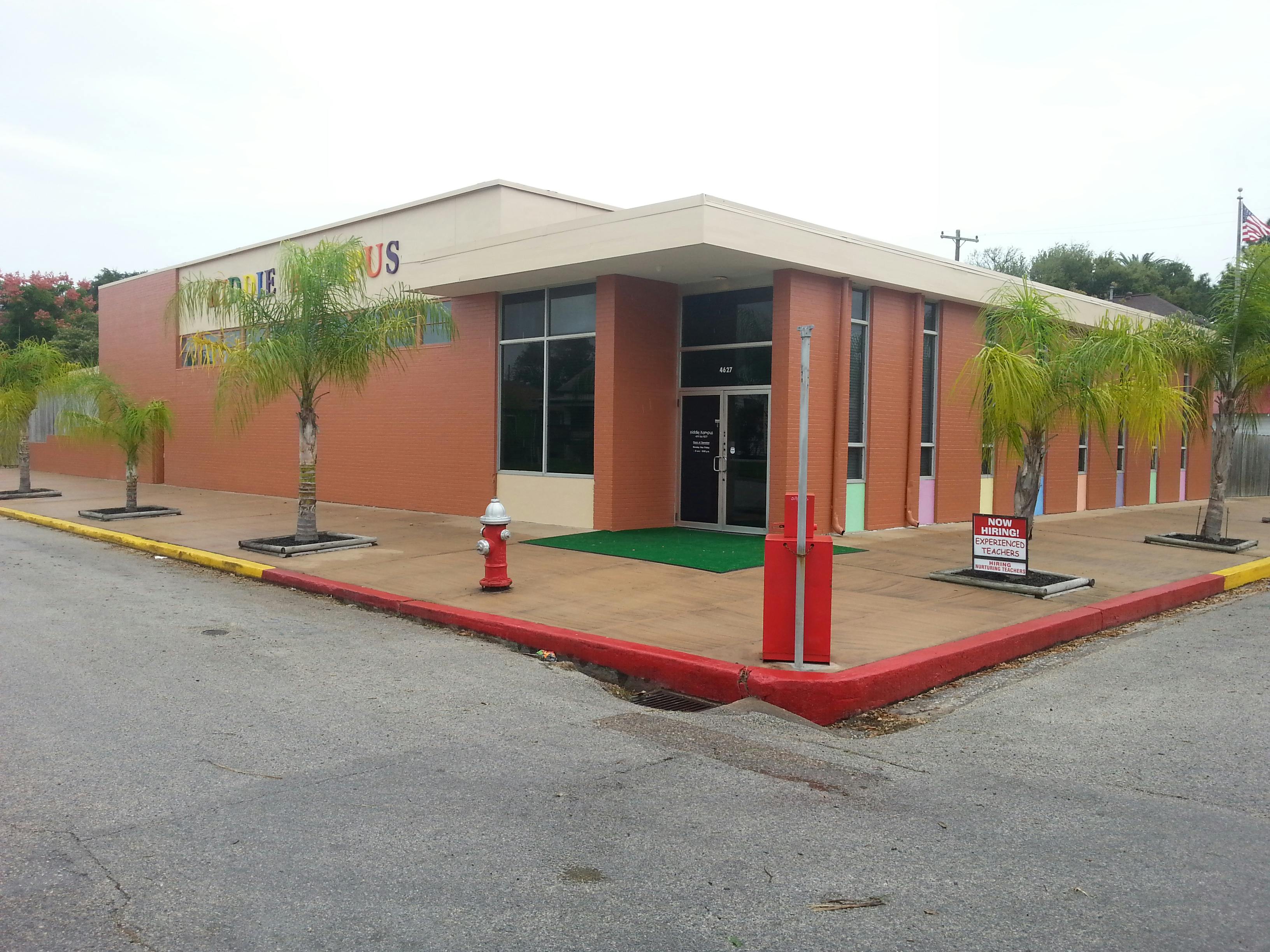 Exterior of a building with a sign that reads "TOYS R US"