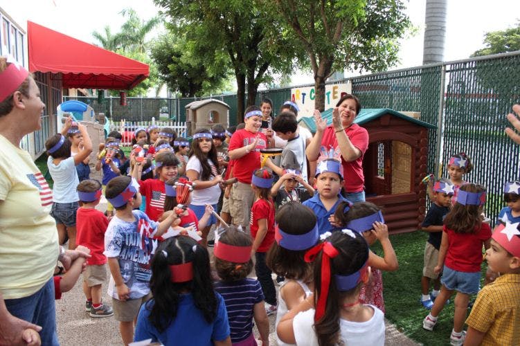 Adults and children in red, white, and blue headbands