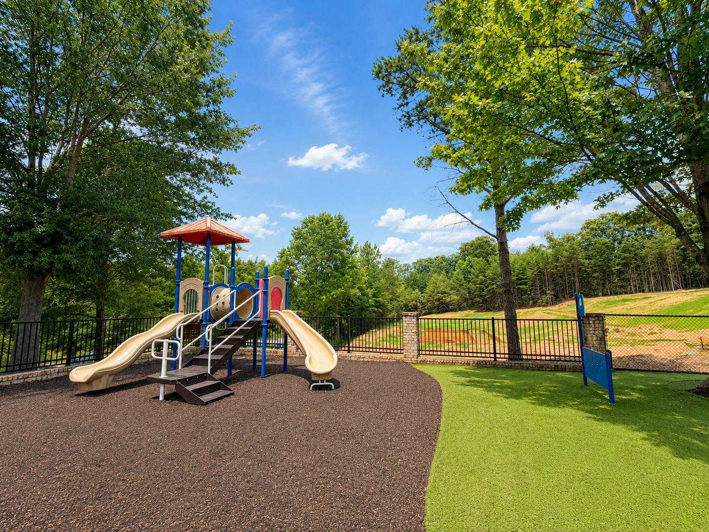 Playground structure with slides in an outdoor area