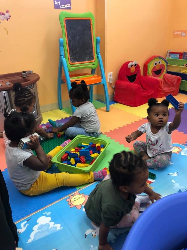 Children playing with blocks in a classroom