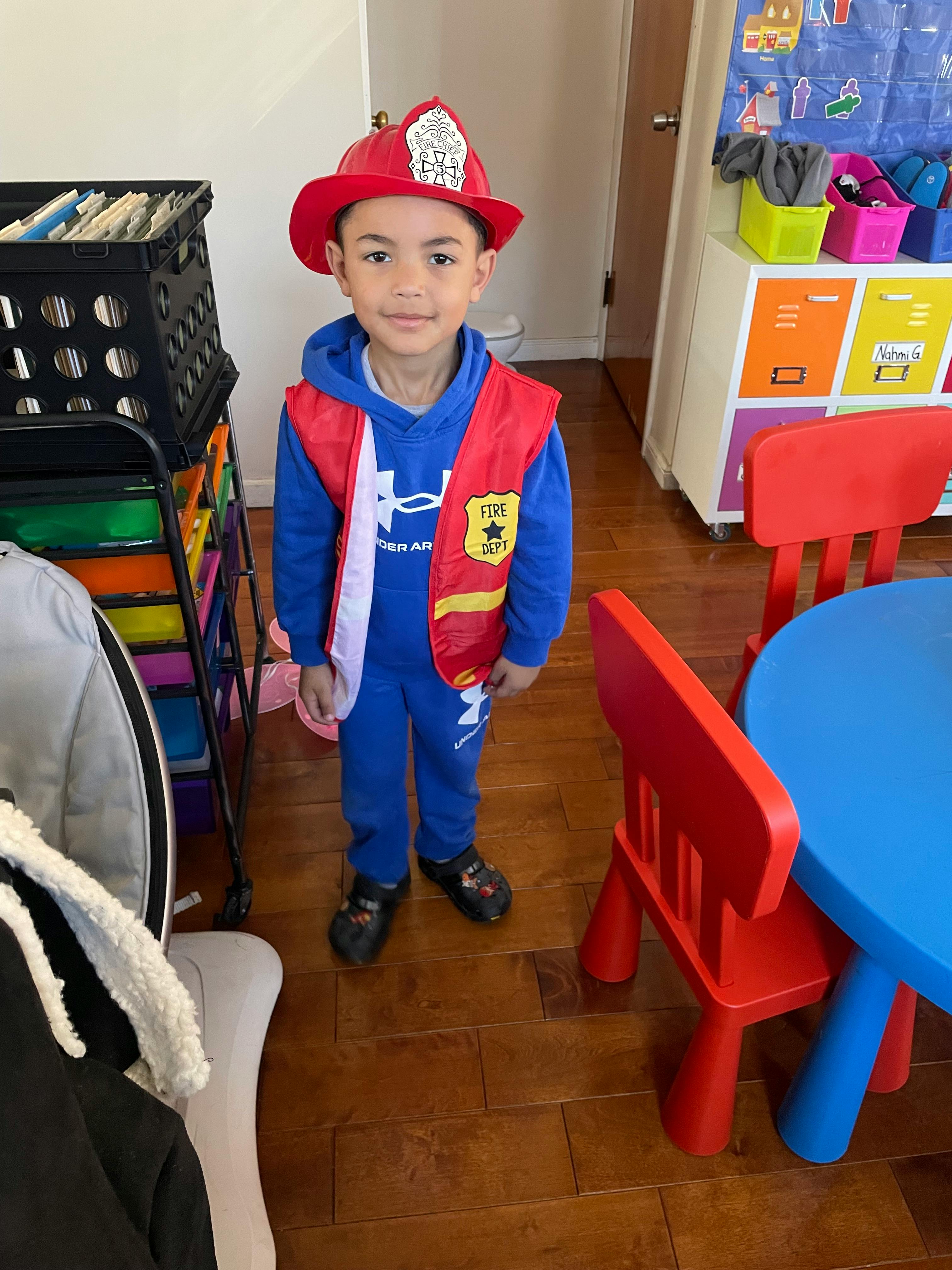 Child in a firefighter costume