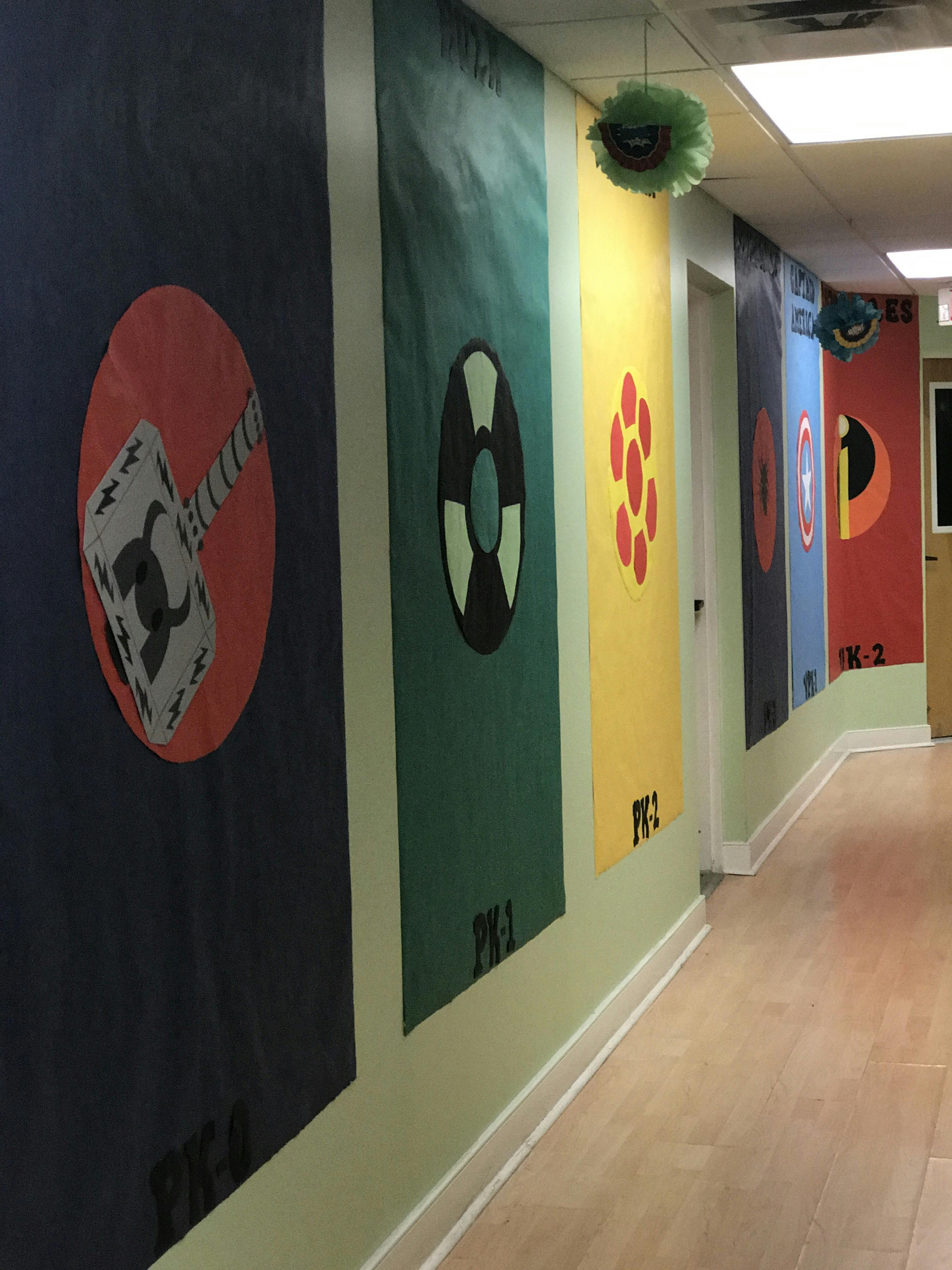 Hallway with colorful banners featuring various symbols