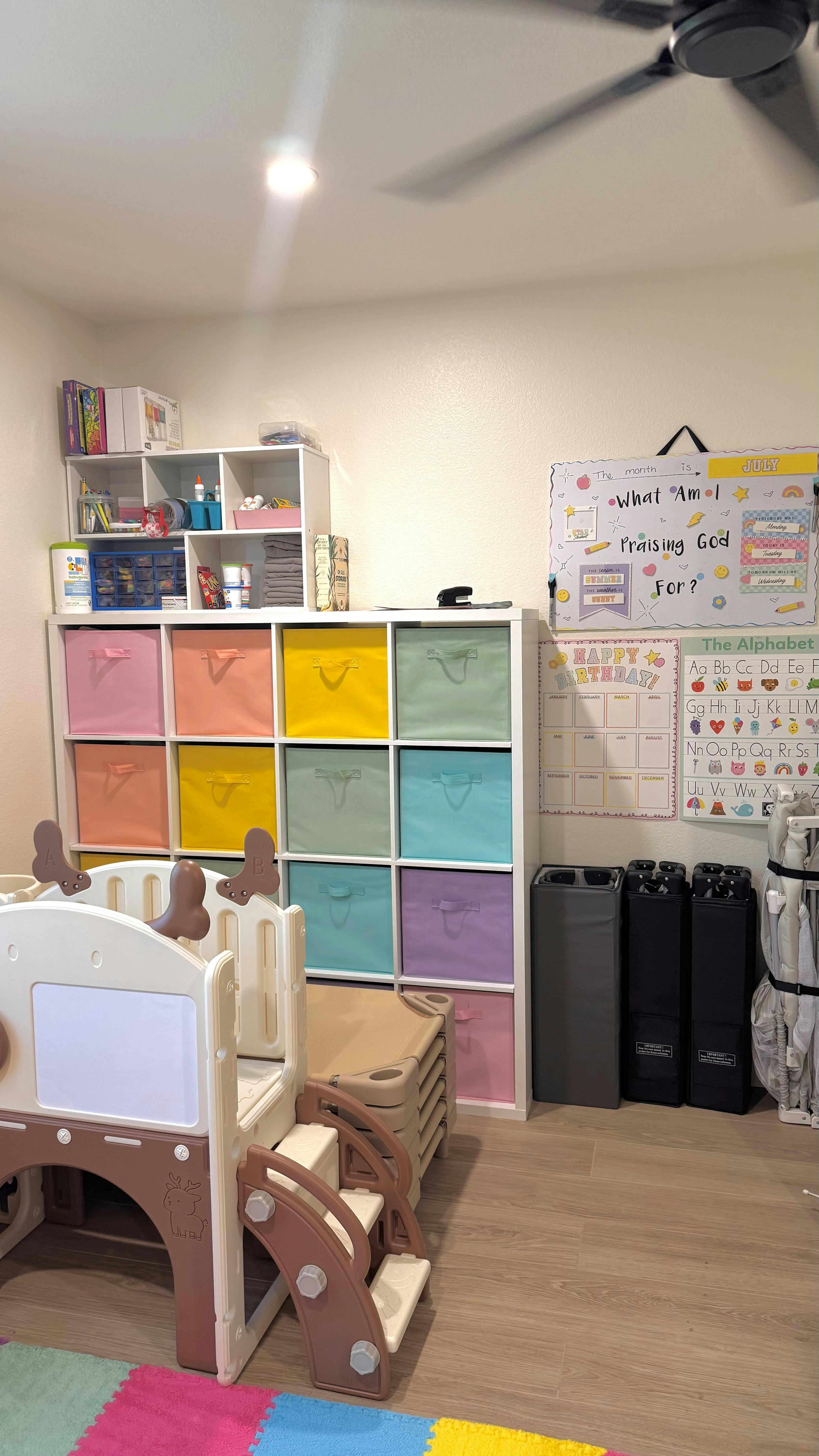 Playroom with colorful storage cubbies and educational wall charts