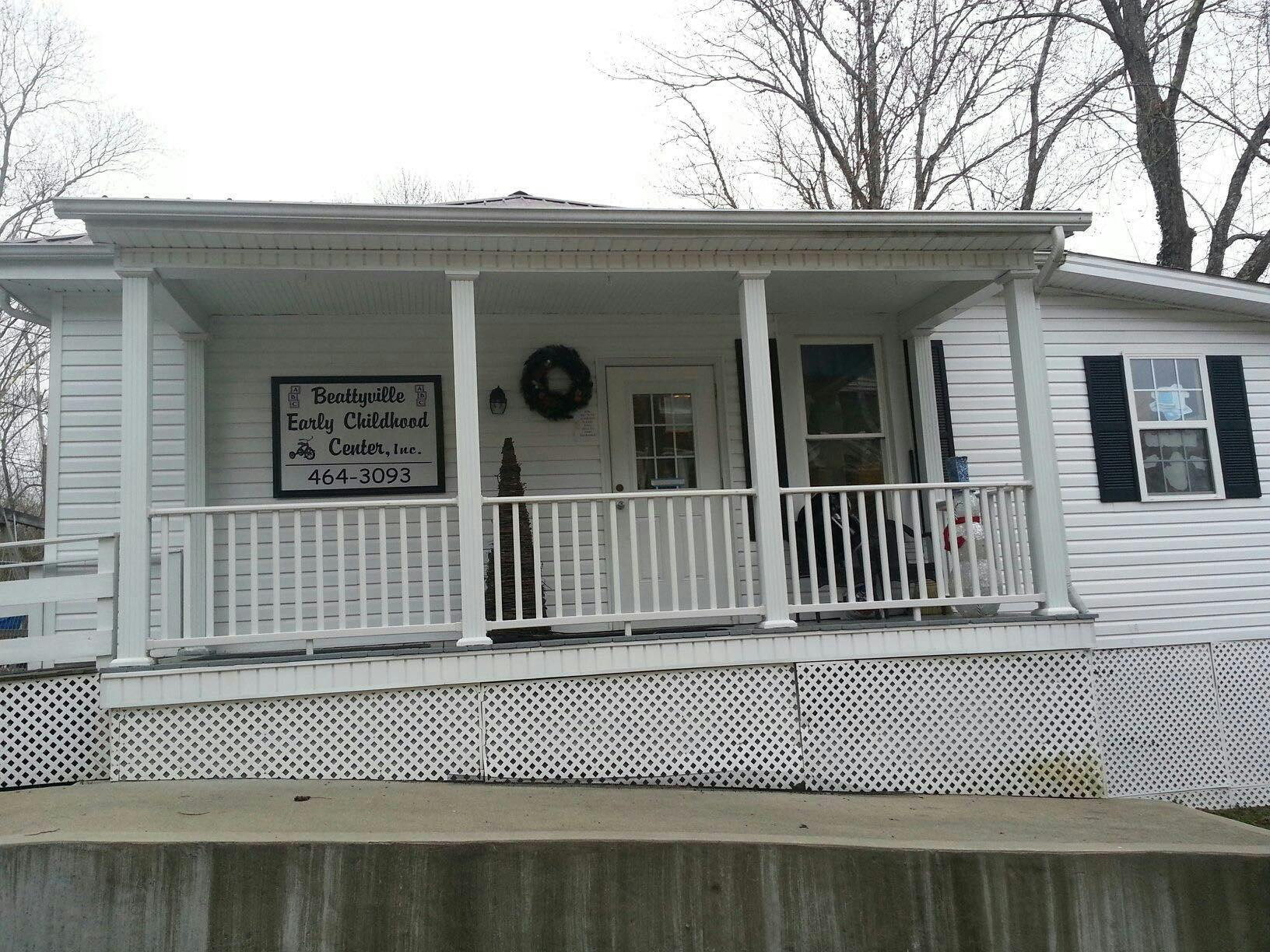 White house with a porch and a sign that reads "Boonville Living Children's Life Center"