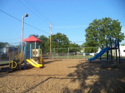 Empty playground with slides and swings