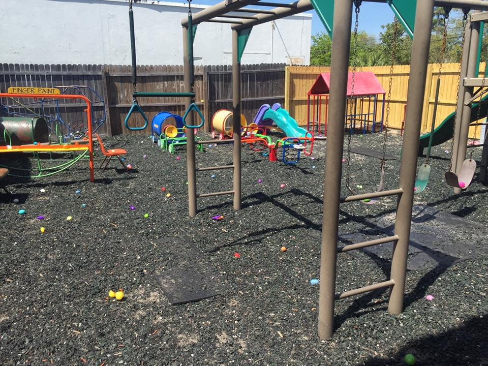 Empty playground with swings, slides, and monkey bars