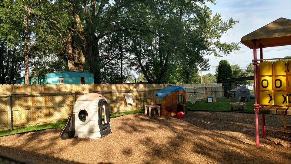 Playground with a small playhouse and a tic-tac-toe game