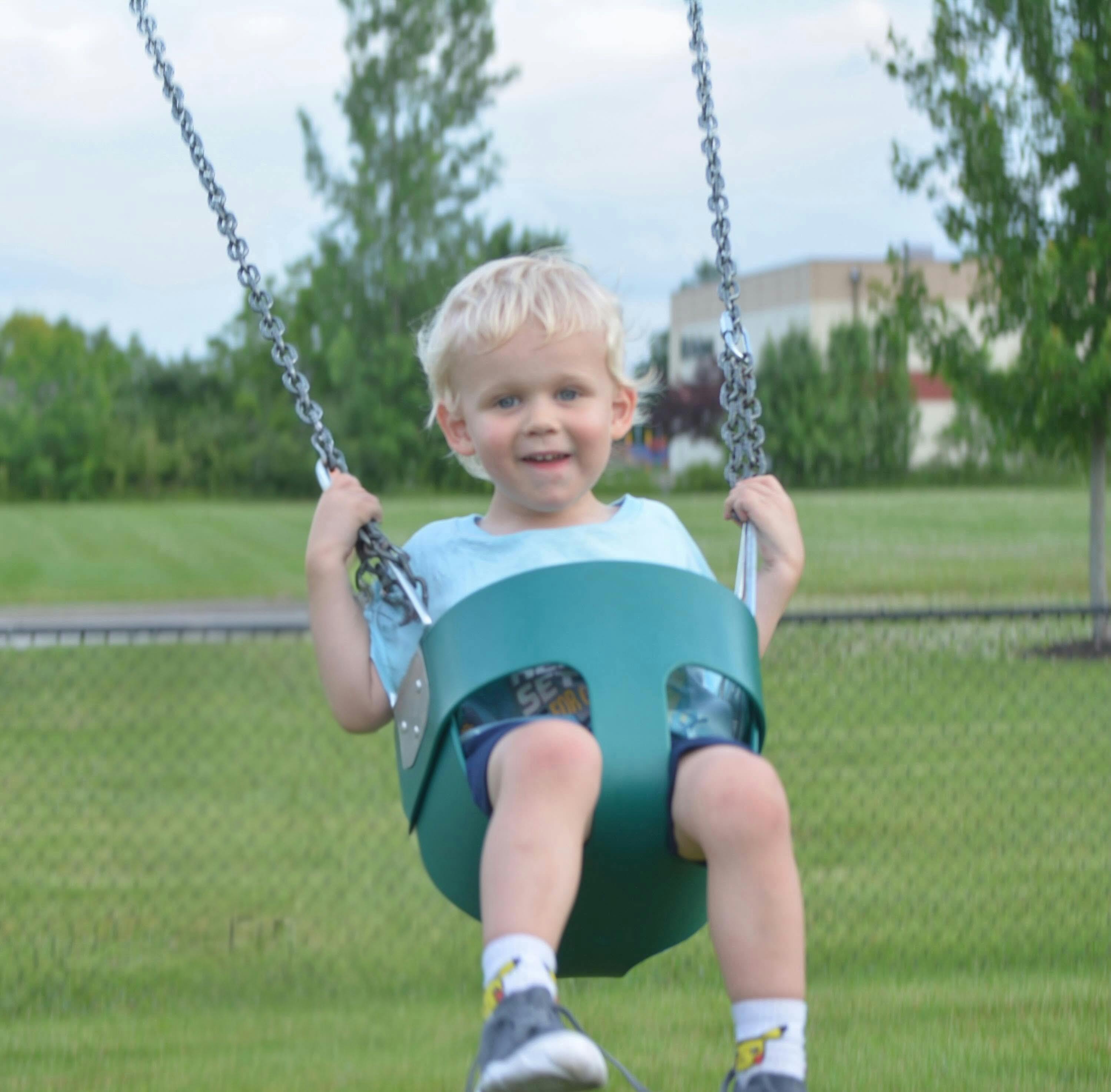Child on a playground swing