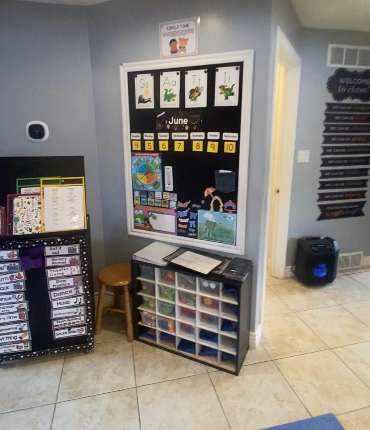 Classroom with a calendar, storage cubbies, and a schedule board
