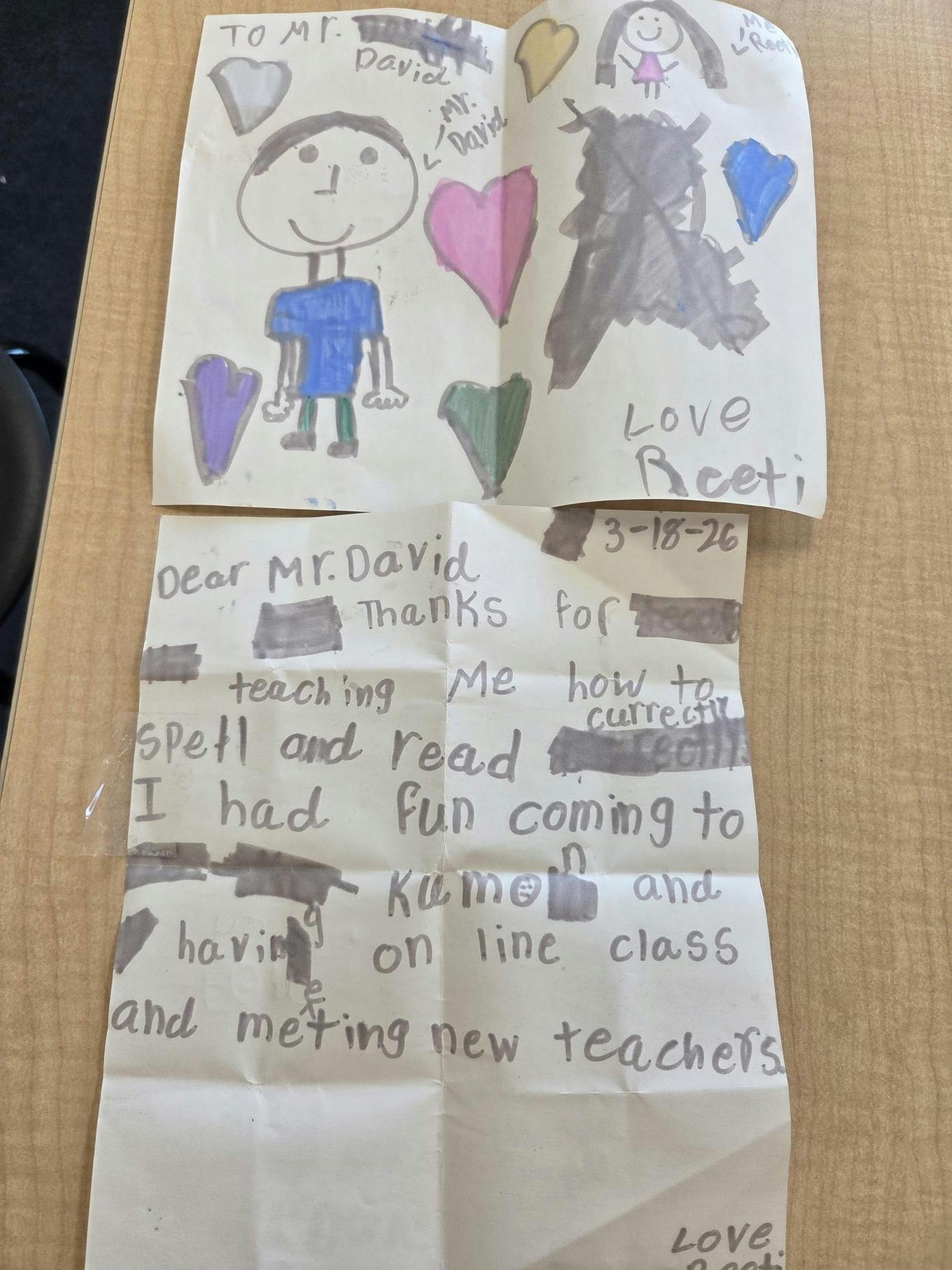 Child's drawing of two people with hearts and a handwritten thank you note