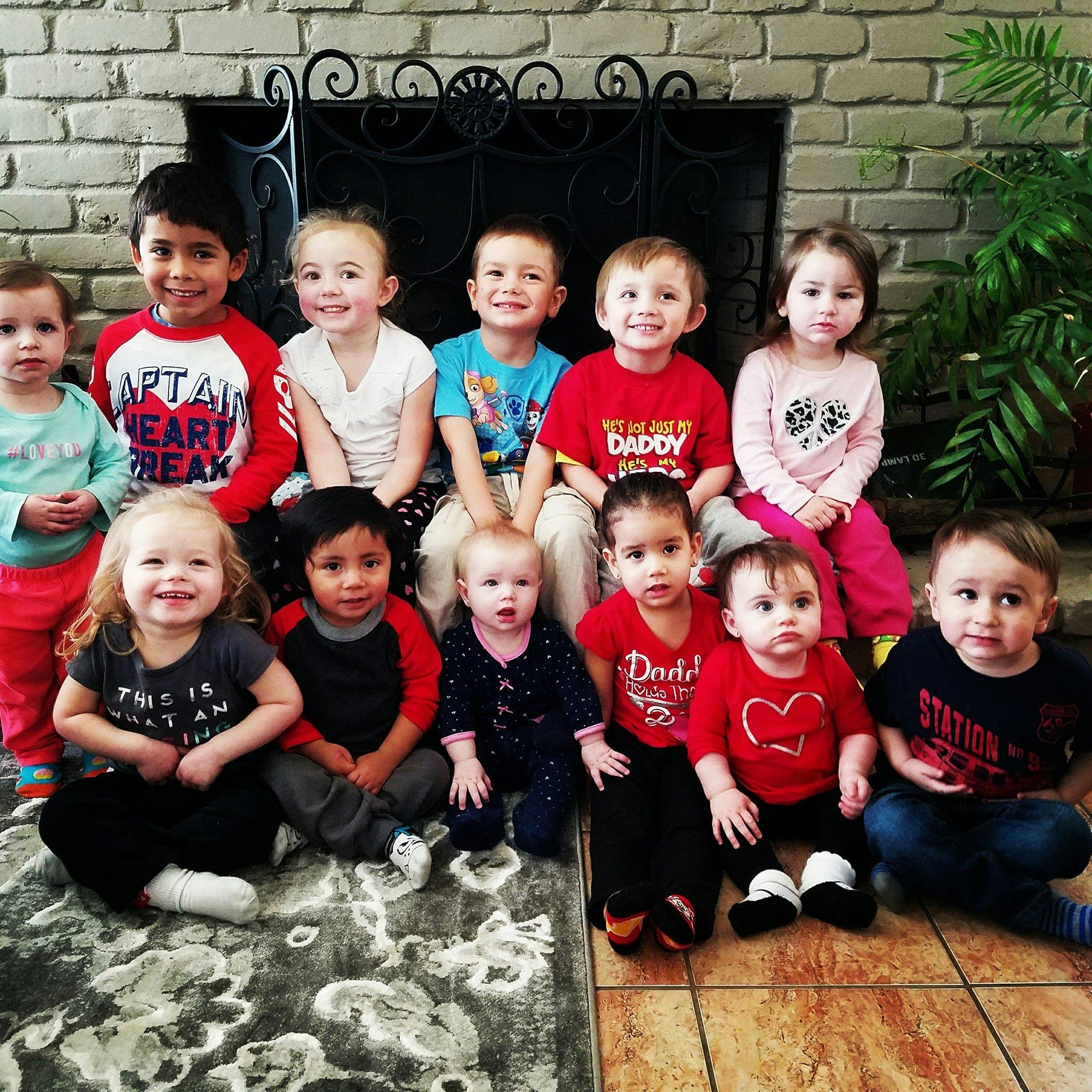 Group of children and babies sitting together