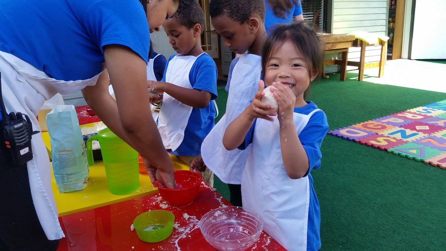 Adult and children making crafts at a table