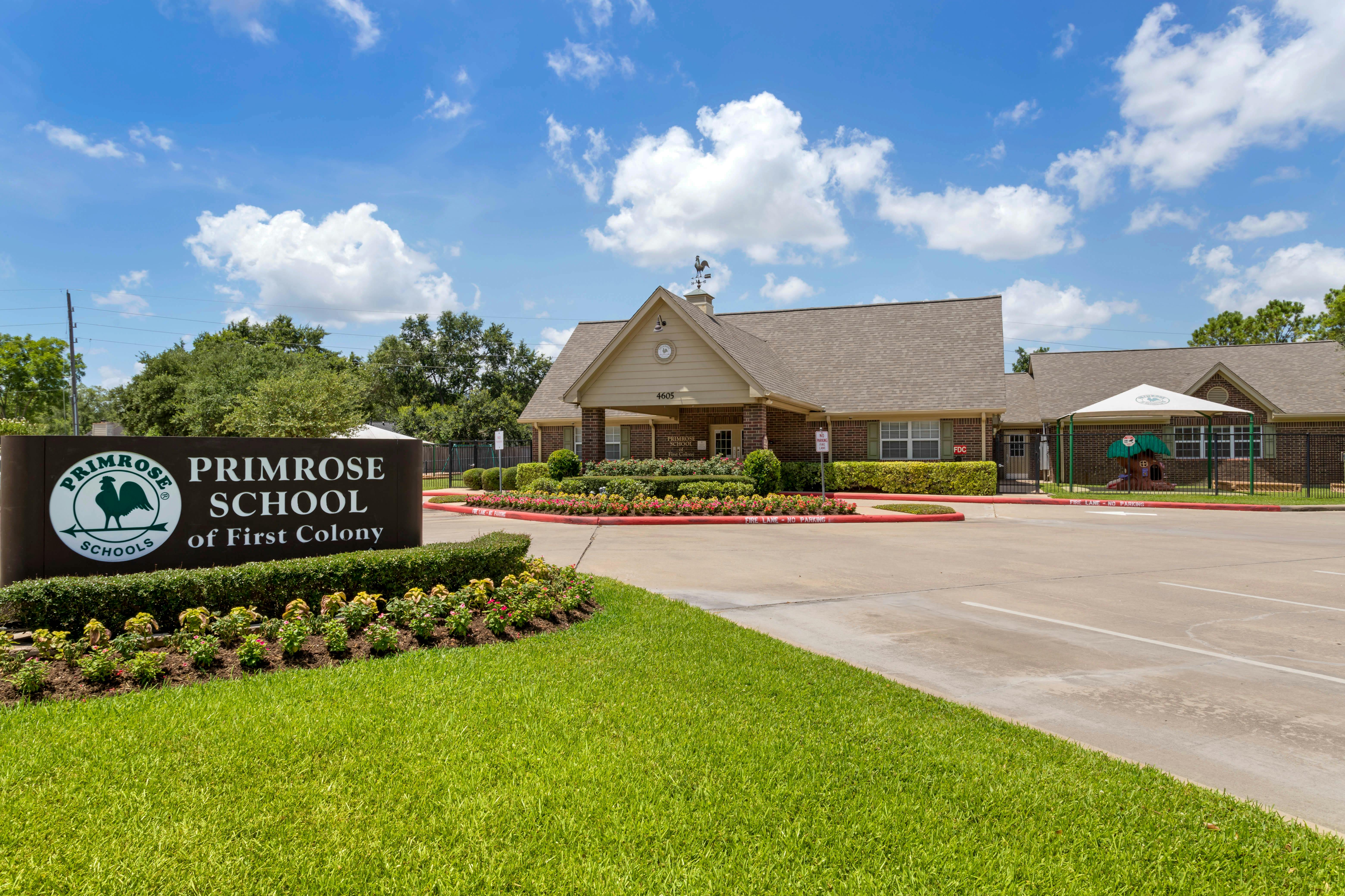 Primrose School of First Colony sign and building exterior with a playground