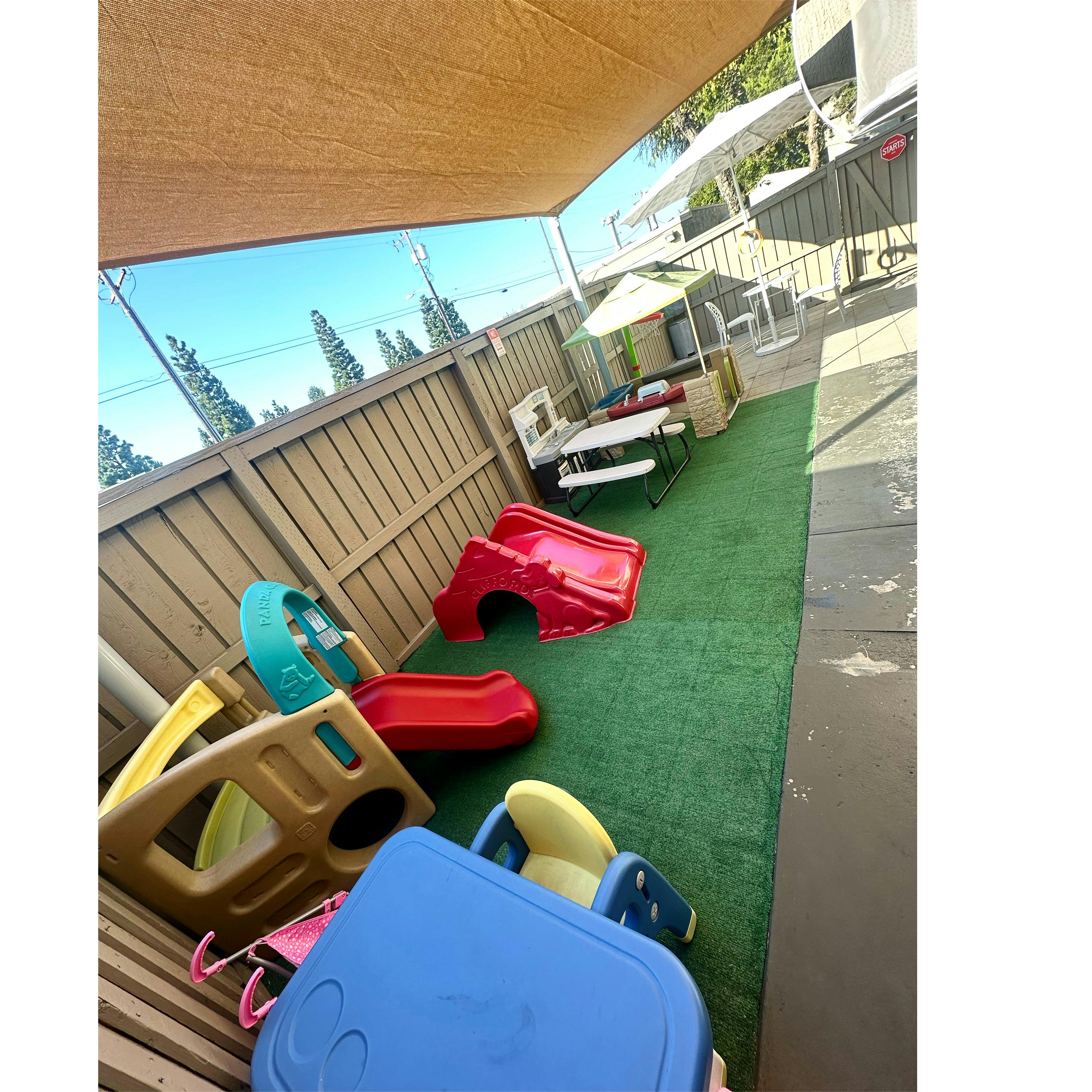 Playground with slides and tables on artificial turf