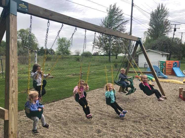 Children on swings at a playground