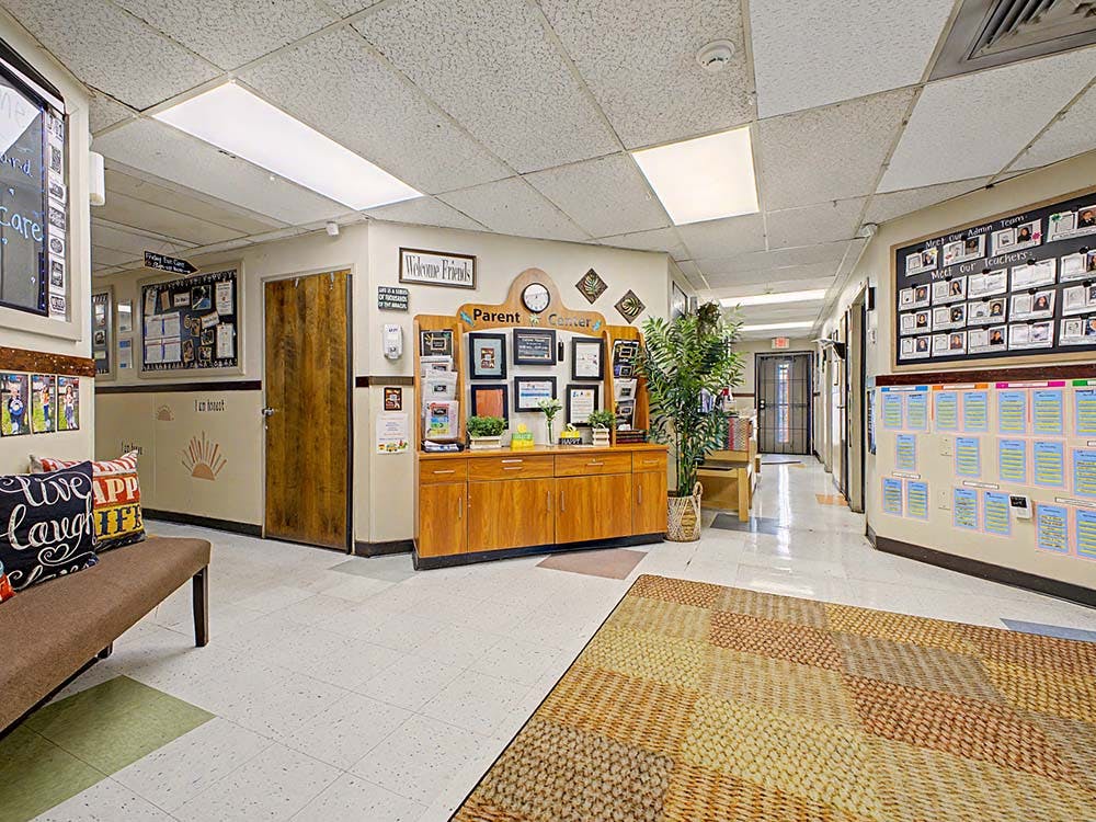 Hallway with a parent corner and bulletin boards