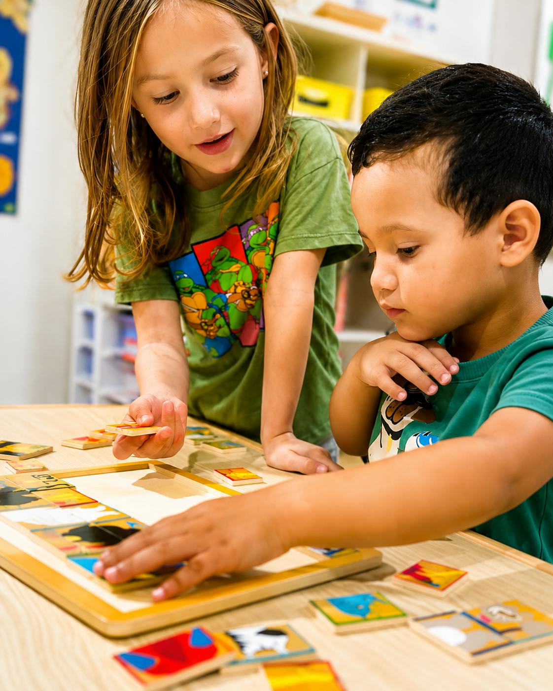 Two children working together to complete a puzzle on a table