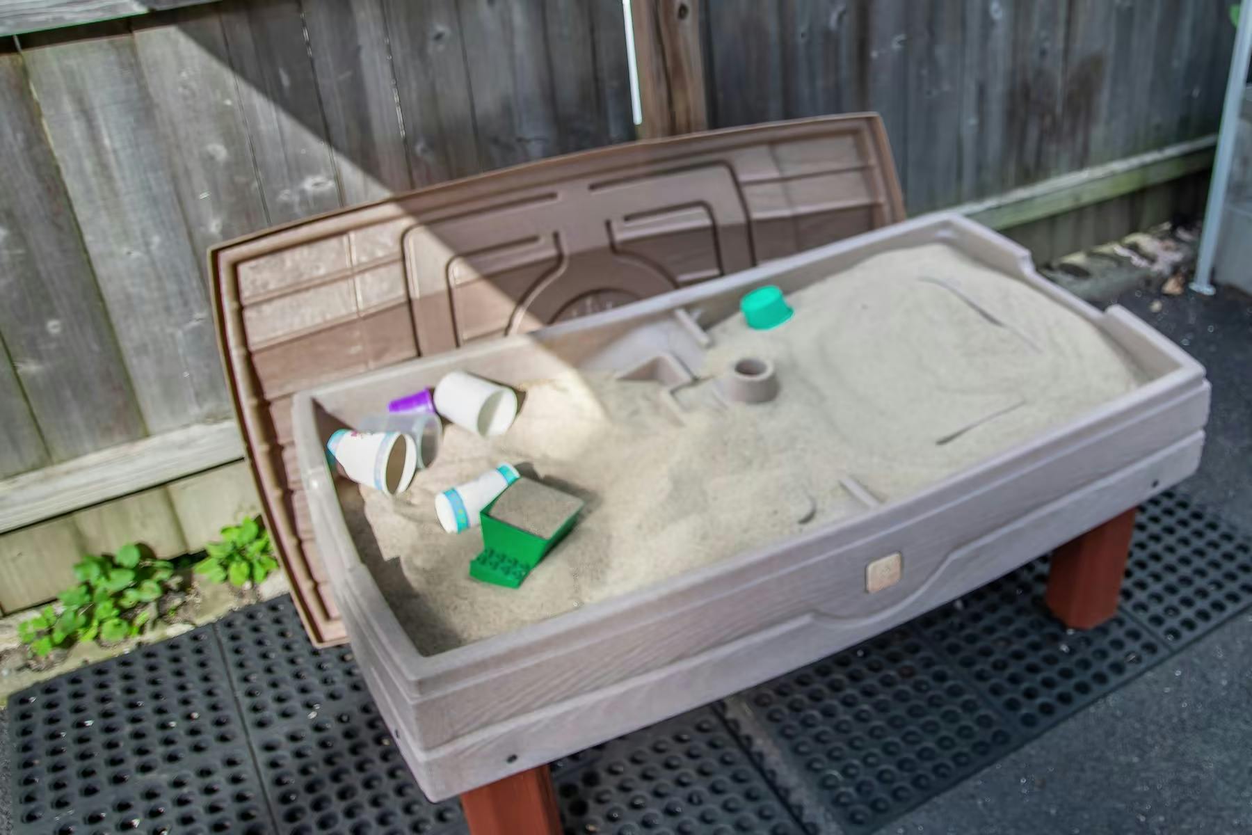 Sand table with sand and toys
