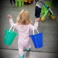 Child carrying two buckets