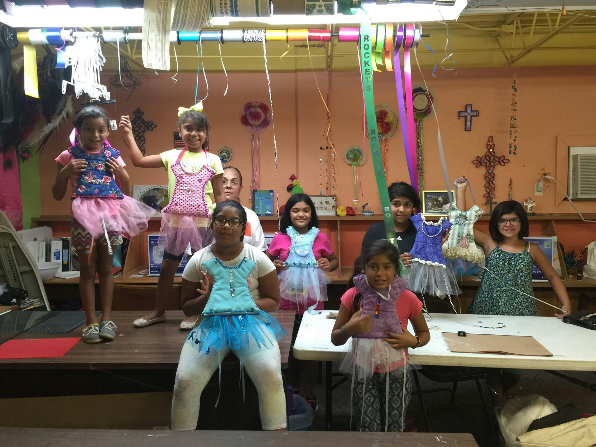 Children and adults in a room with decorations