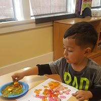 Child painting with food