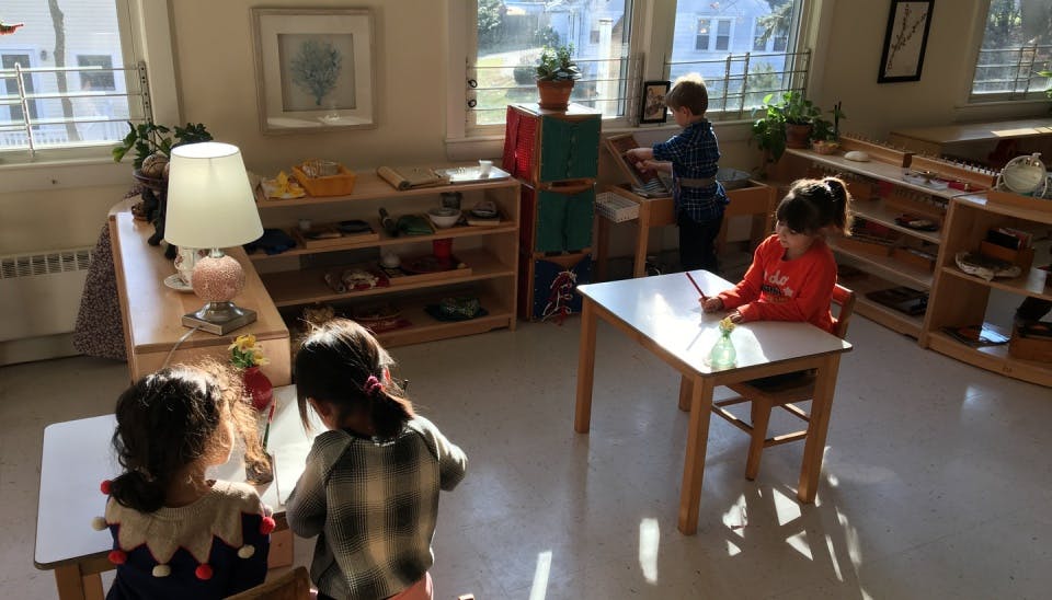 Three children in a classroom