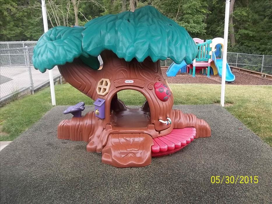A toy treehouse and a playground slide structure