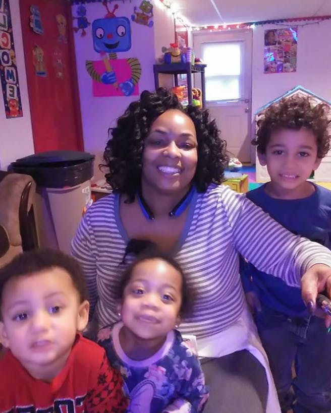 Person with three children