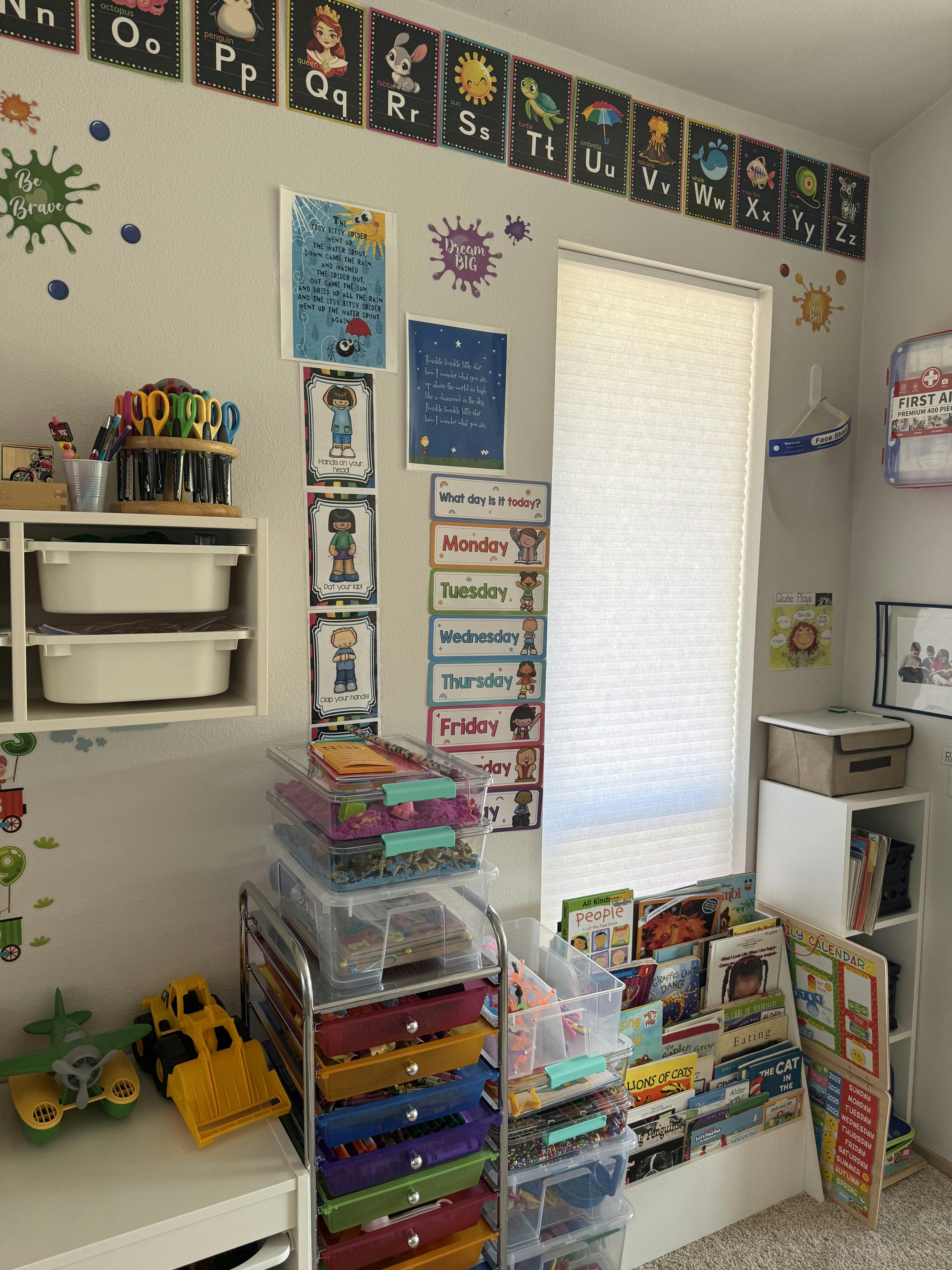 Classroom wall decorated with an alphabet chart and educational posters