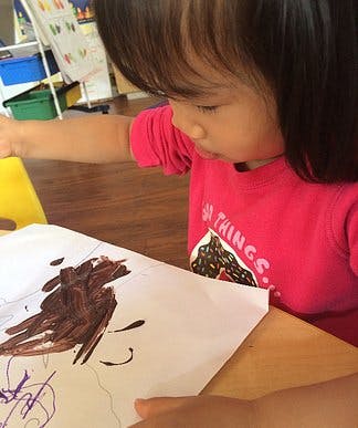 Child painting on paper
