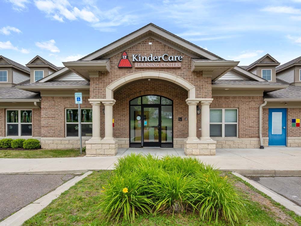 KinderCare Learning Centers building exterior with blue door