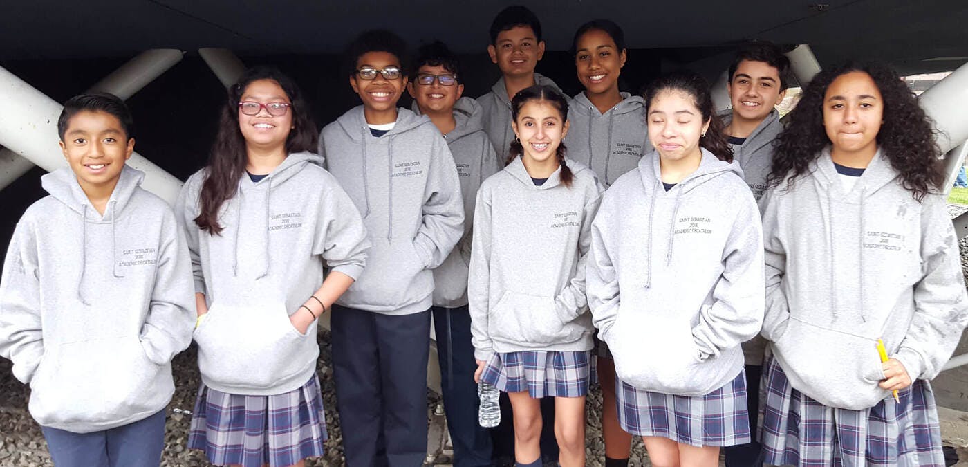 Group of children and teens posing for a photo