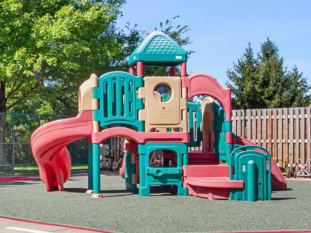 Colorful plastic playground structure with slides