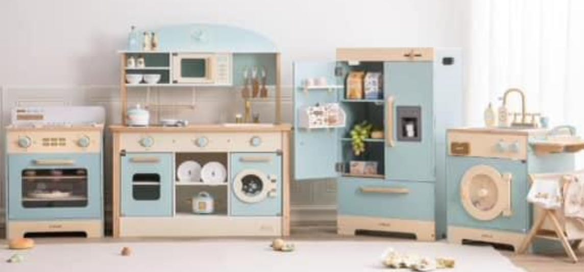 Play kitchen set with stove, sink, refrigerator, and washing machine