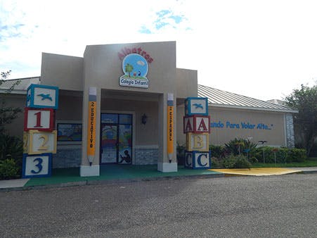 Building entrance with large decorative blocks spelling out 123 and ABC