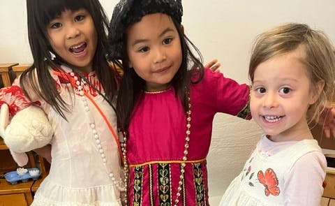 Three children posing together