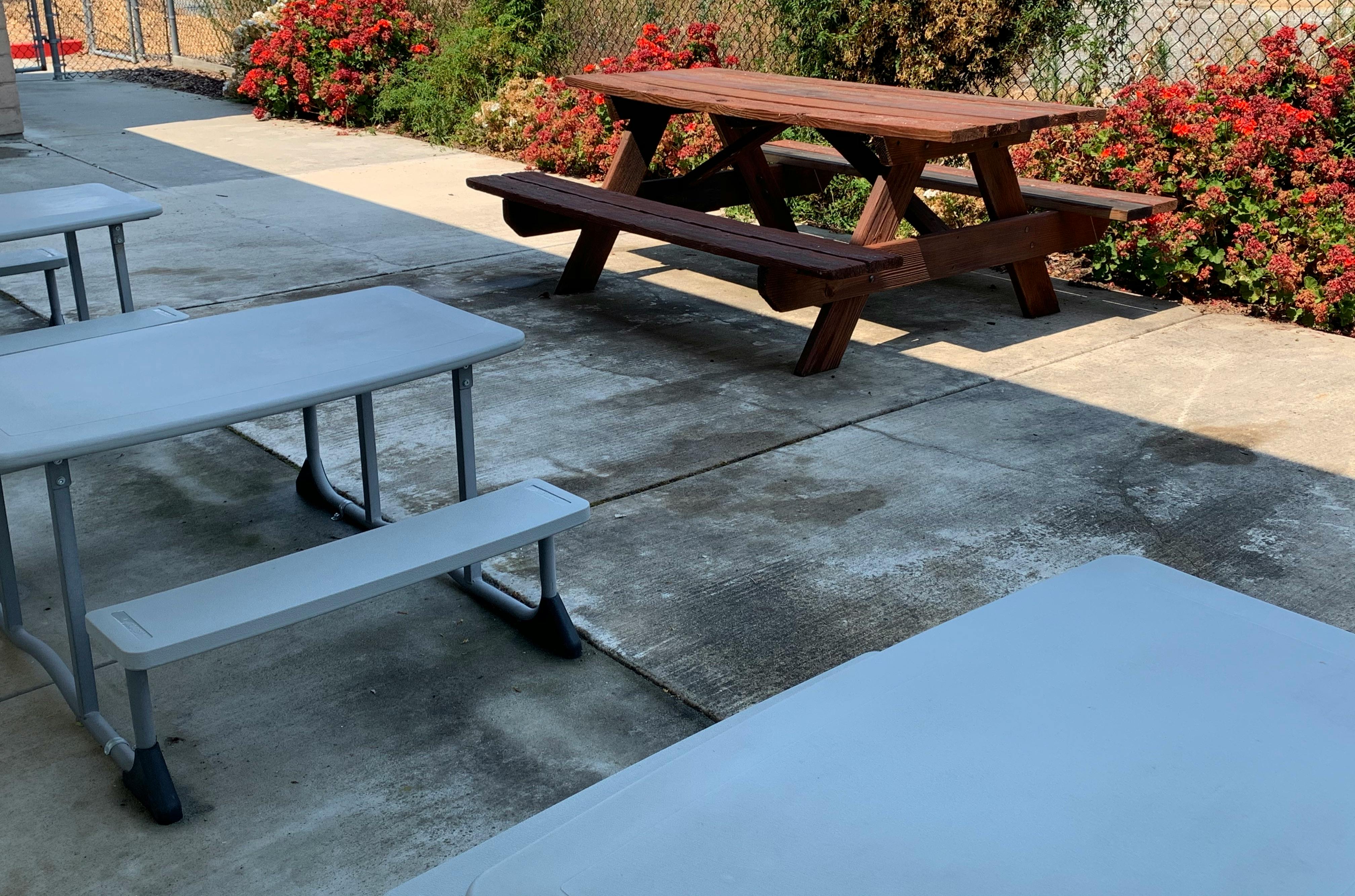 Picnic tables on a concrete patio